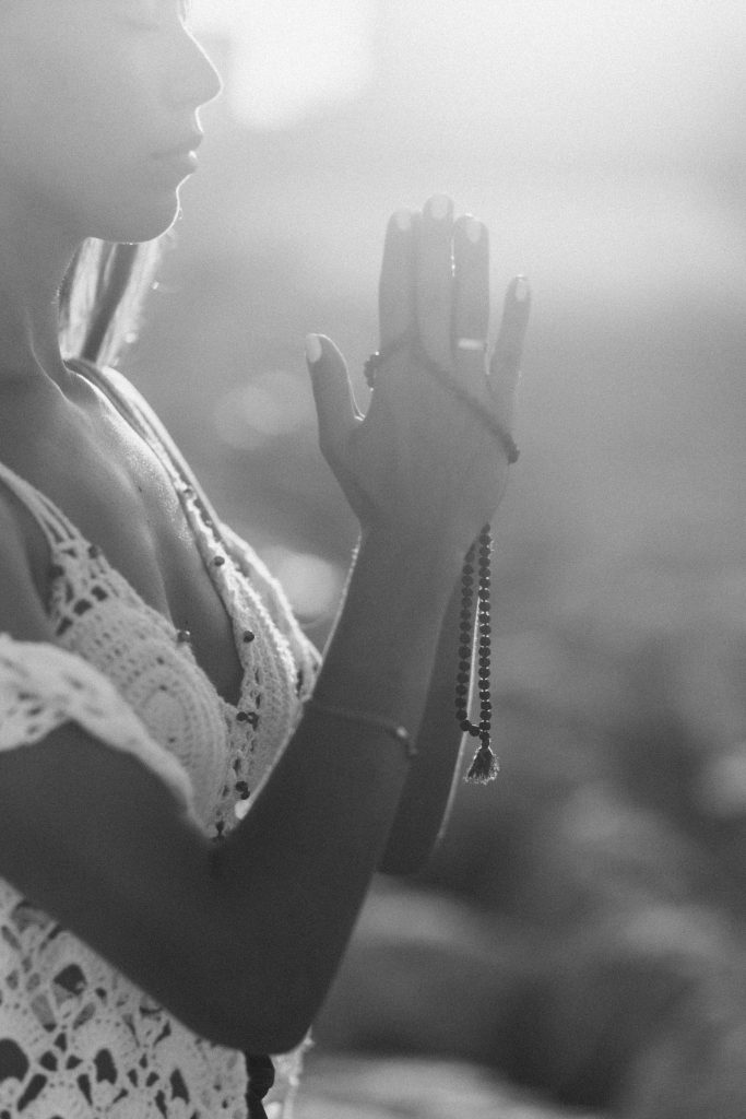 Woman peaceful praying in breathwork meditation